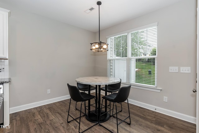 9 Moss Side Ter, Durham, NC 27703 - dining area with a chandelier and dark wood-type flooring
