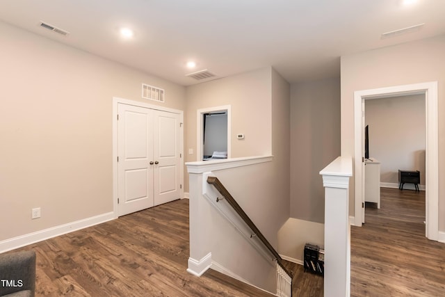 9 Moss Side Ter, Durham, NC 27703 - hallway with an upstairs landing, dark wood-type flooring, and recessed lighting