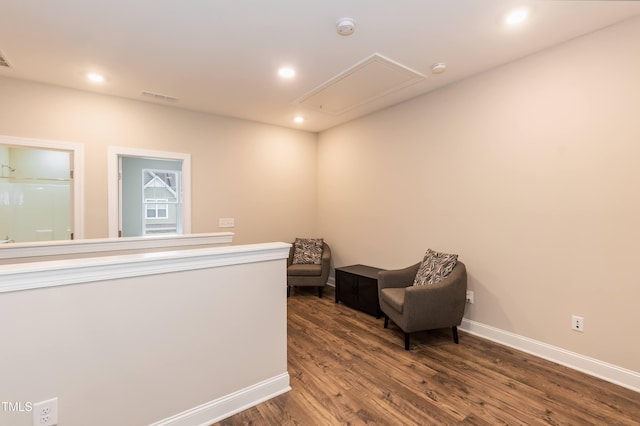 9 Moss Side Ter, Durham, NC 27703 - sitting room with attic access, wood finished floors, and recessed lighting