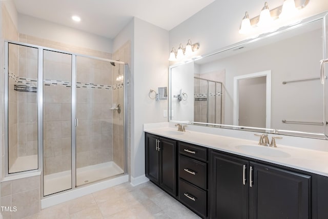 9 Moss Side Ter, Durham, NC 27703 - bathroom with a shower stall, double vanity, and tile patterned floors