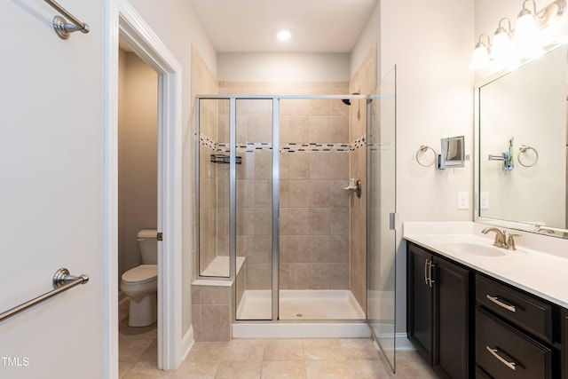9 Moss Side Ter, Durham, NC 27703 - bathroom with tile patterned floors, a shower stall, vanity, and recessed lighting