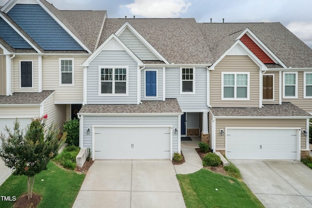 9 Moss Side Ter, Durham, NC 27703 - townhome / multi-family property featuring an attached garage, driveway, and roof with shingles