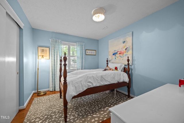 926 Wimbleton Dr, Raleigh, NC 27609 - bedroom featuring baseboards and wood finished floors