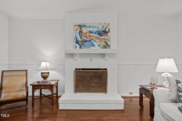 926 Wimbleton Dr, Raleigh, NC 27609 - living area featuring wainscoting, ornamental molding, wood finished floors, and a fireplace