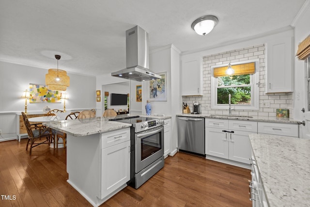 926 Wimbleton Dr, Raleigh, NC 27609 - kitchen with stainless steel appliances, island range hood, a peninsula, crown molding, and white cabinets