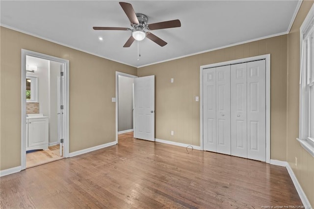 425 N Platte Rd, Fayetteville, NC 28303 - unfurnished bedroom featuring wood finished floors, crown molding, a closet, ensuite bathroom, and ceiling fan