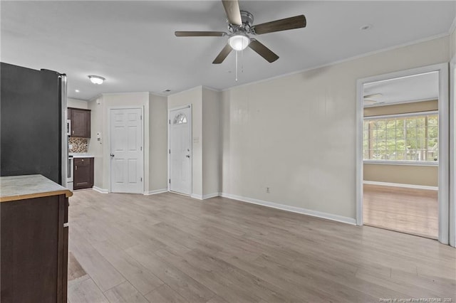 425 N Platte Rd, Fayetteville, NC 28303 - unfurnished living room featuring ceiling fan, light wood finished floors, and ornamental molding