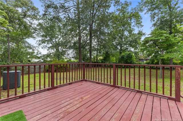425 N Platte Rd, Fayetteville, NC 28303 - wooden deck with a yard and view of wooded area