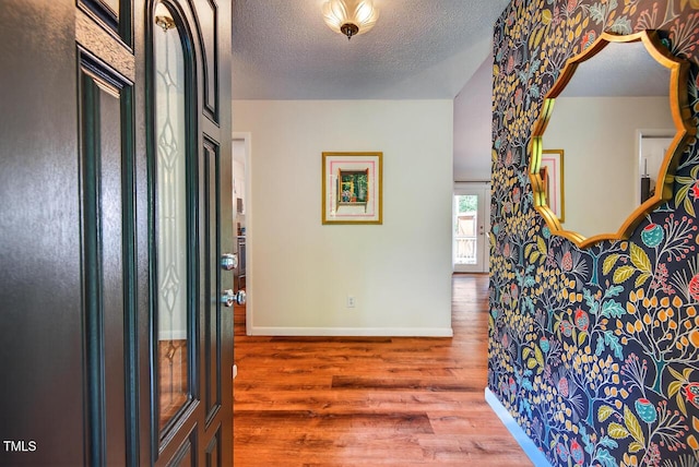 810 Royal Oaks Dr, Durham, NC 27712 - foyer with wood finished floors and a textured ceiling