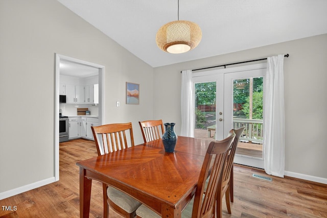 810 Royal Oaks Dr, Durham, NC 27712 - dining area featuring light wood finished floors, lofted ceiling, and french doors