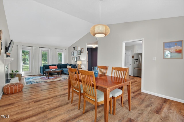 810 Royal Oaks Dr, Durham, NC 27712 - dining room with light wood-type flooring and lofted ceiling