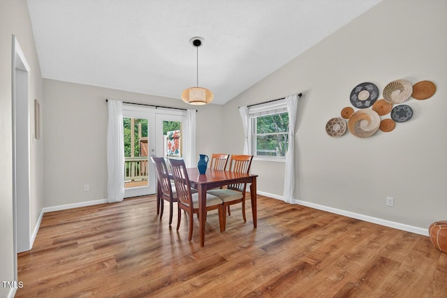 810 Royal Oaks Dr, Durham, NC 27712 - dining space with vaulted ceiling, wood finished floors, and french doors