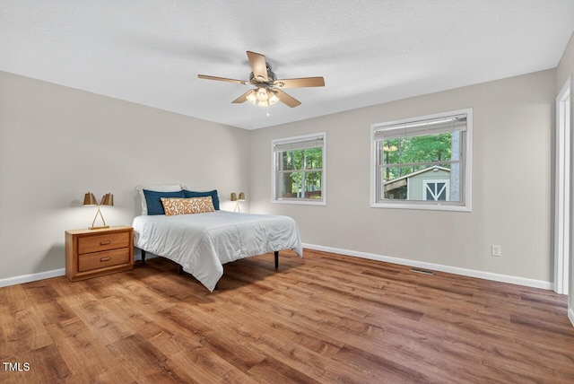 810 Royal Oaks Dr, Durham, NC 27712 - bedroom featuring wood finished floors and a ceiling fan