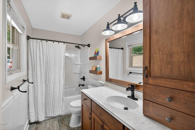 810 Royal Oaks Dr, Durham, NC 27712 - bathroom featuring vanity, wood finished floors, and shower / bath combo with shower curtain