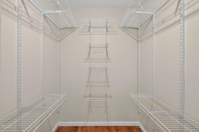 810 Royal Oaks Dr, Durham, NC 27712 - walk in closet featuring wood finished floors