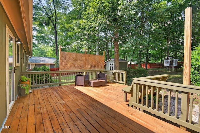 810 Royal Oaks Dr, Durham, NC 27712 - deck featuring a storage unit, a fenced backyard, and view of scattered trees