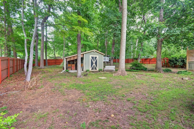 810 Royal Oaks Dr, Durham, NC 27712 - fenced backyard with a shed and view of wooded area