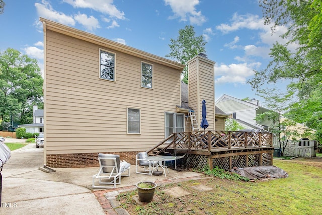 1408 Morningsdale Dr, Raleigh, NC 27609 - back of house with a patio area, a deck, and a chimney