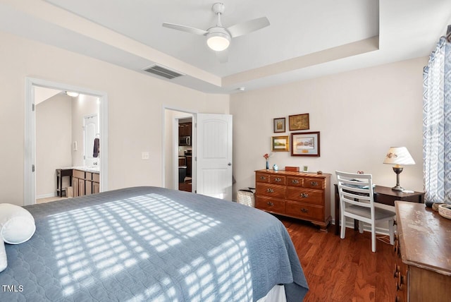 1924 Rustica Dr, Durham, NC 27713 - bedroom with wood finished floors, a tray ceiling, and ceiling fan