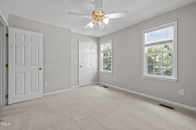 400 Nottinghill Walk, Apex, NC 27502 - unfurnished bedroom featuring multiple windows, carpet flooring, ceiling fan, and a closet