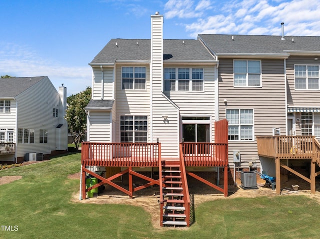 400 Nottinghill Walk, Apex, NC 27502 - back of property featuring a wooden deck, stairs, a lawn, and a chimney