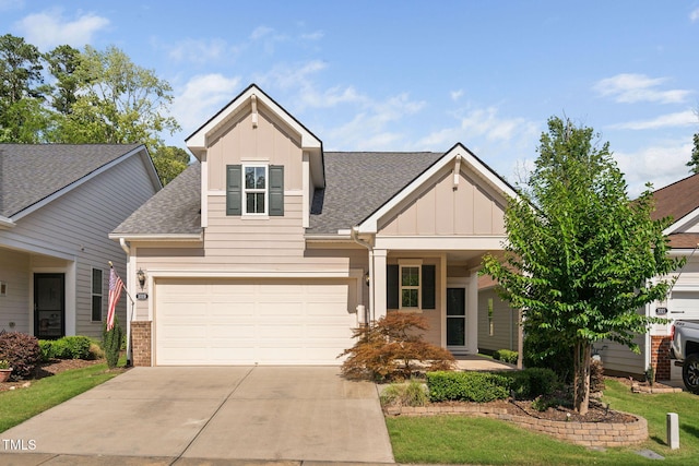 1019 Santiago St, Durham, NC 27703 - view of front of house with board and batten siding, roof with shingles, and driveway