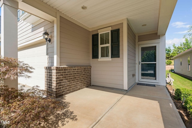 1019 Santiago St, Durham, NC 27703 - view of exterior entry with a garage
