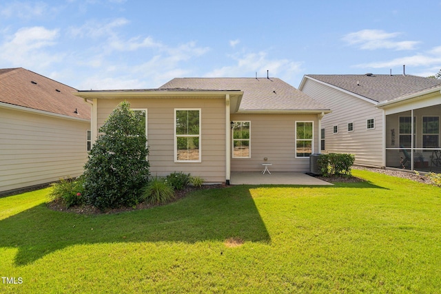 1019 Santiago St, Durham, NC 27703 - rear view of house with a patio and a lawn