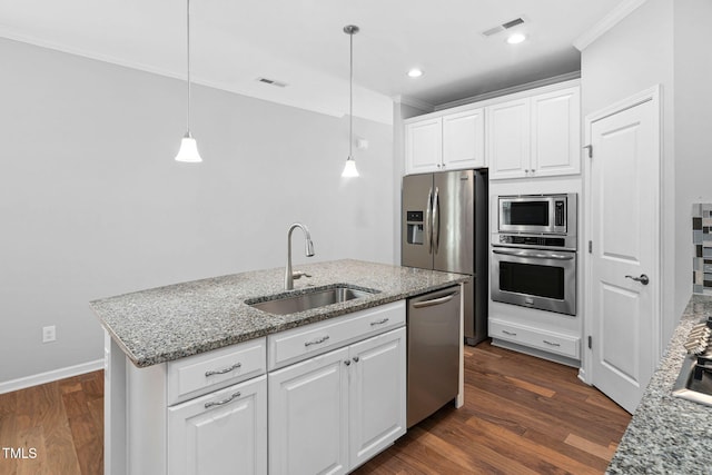 1019 Santiago St, Durham, NC 27703 - kitchen featuring appliances with stainless steel finishes, crown molding, white cabinetry, hanging light fixtures, and dark wood-style floors
