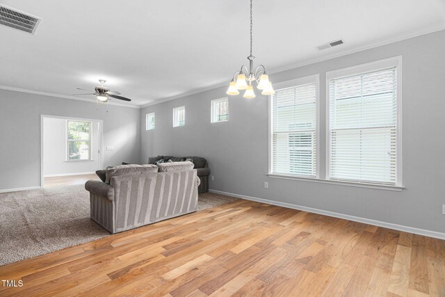 1019 Santiago St, Durham, NC 27703 - living area with crown molding, light wood-style flooring, a chandelier, and a ceiling fan