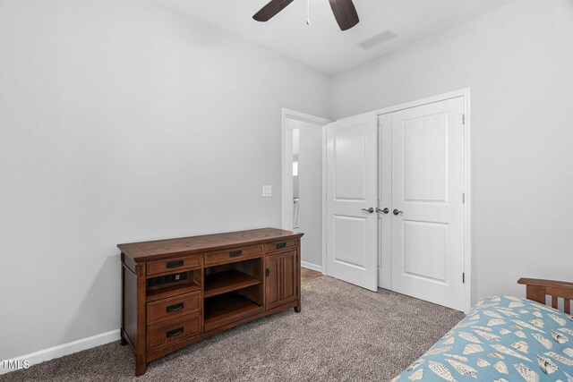 1019 Santiago St, Durham, NC 27703 - bedroom featuring light carpet, ceiling fan, and a closet