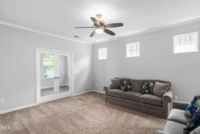1019 Santiago St, Durham, NC 27703 - living room with crown molding, carpet, healthy amount of natural light, ceiling fan, and french doors