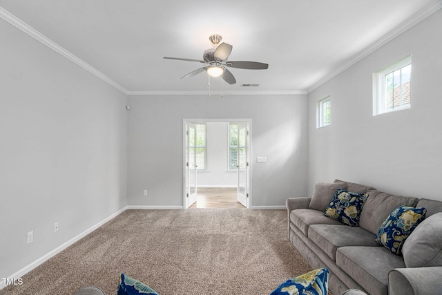 1019 Santiago St, Durham, NC 27703 - living room featuring light colored carpet, plenty of natural light, a ceiling fan, and ornamental molding