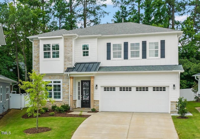 525 Kings Lake Way, Durham, NC 27703 - view of front of property with stone siding, an attached garage, concrete driveway, and a shingled roof