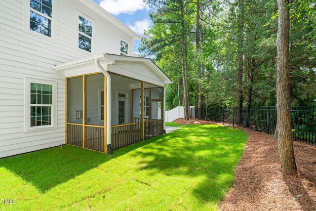 525 Kings Lake Way, Durham, NC 27703 - fenced backyard featuring a sunroom