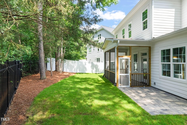 525 Kings Lake Way, Durham, NC 27703 - fenced backyard with a sunroom and a patio