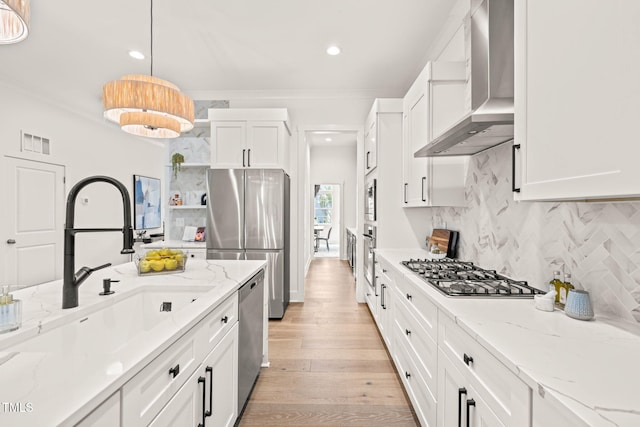 525 Kings Lake Way, Durham, NC 27703 - kitchen with wall chimney range hood, appliances with stainless steel finishes, open shelves, white cabinetry, and tasteful backsplash