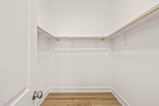 525 Kings Lake Way, Durham, NC 27703 - walk in closet featuring wood finished floors