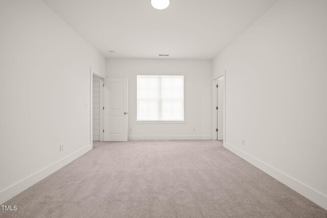 525 Kings Lake Way, Durham, NC 27703 - carpeted empty room featuring baseboards