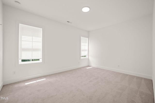 525 Kings Lake Way, Durham, NC 27703 - carpeted empty room with a smoke detector and baseboards