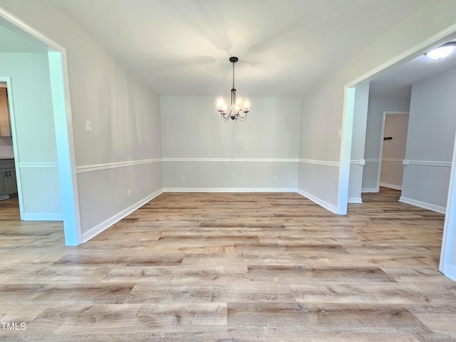 112 Saddletree Rd, Oxford, NC 27565 - unfurnished dining area featuring wood finished floors and a chandelier
