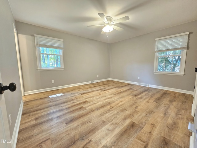 112 Saddletree Rd, Oxford, NC 27565 - empty room featuring plenty of natural light, light wood-style floors, and a ceiling fan