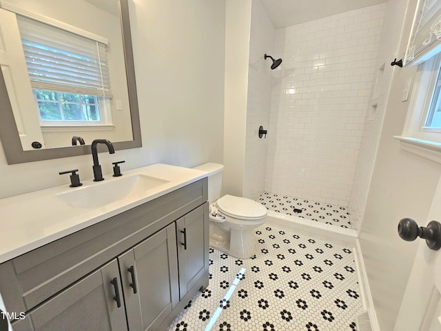 112 Saddletree Rd, Oxford, NC 27565 - bathroom featuring vanity, a tile shower, and tile patterned flooring