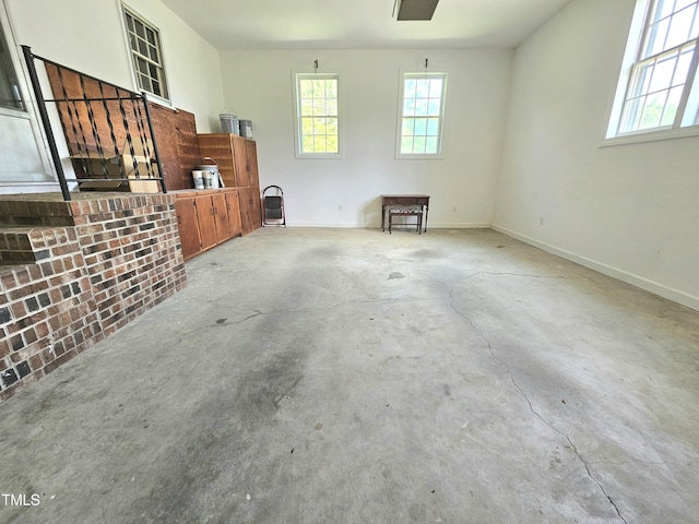112 Saddletree Rd, Oxford, NC 27565 - unfurnished living room featuring healthy amount of natural light and concrete floors