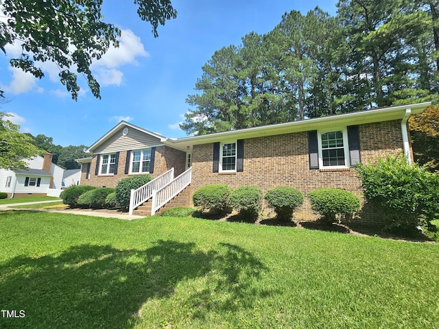 112 Saddletree Rd, Oxford, NC 27565 - ranch-style home featuring brick siding and a front lawn
