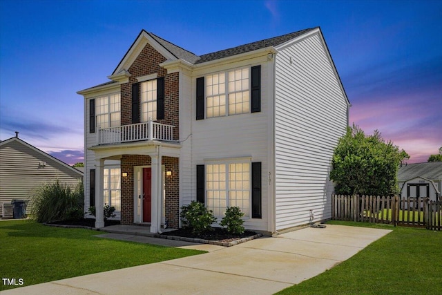 3101 Riverbrooke Dr, Raleigh, NC 27610 - colonial house with a balcony and brick siding