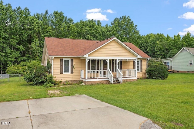 34 Scotts Creek Run, Angier, NC 27501 - bungalow-style home featuring a porch and a shingled roof