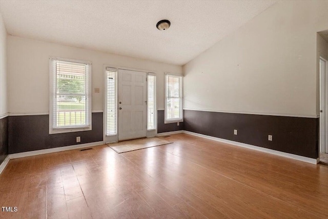 34 Scotts Creek Run, Angier, NC 27501 - foyer with wood finished floors and a textured ceiling