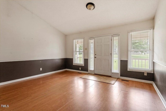 34 Scotts Creek Run, Angier, NC 27501 - entrance foyer featuring healthy amount of natural light, wood finished floors, and lofted ceiling