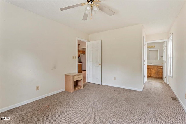 34 Scotts Creek Run, Angier, NC 27501 - unfurnished bedroom featuring light colored carpet, ensuite bathroom, and a ceiling fan